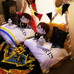 Fairytale themed sleepover setup with lights and decorations